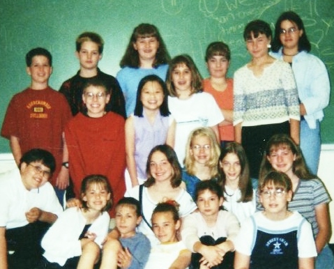 I think this is a picture of my sixth grade homeroom class. I'm just the frumpy weirdo in the back with straight up Zooey bangs. 